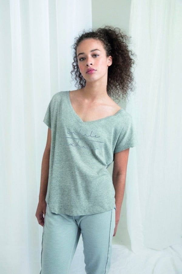 Sacred Threads yoga wear ethically sourced and produced super soft organic cotton womens shaped hem v neck t shirt 